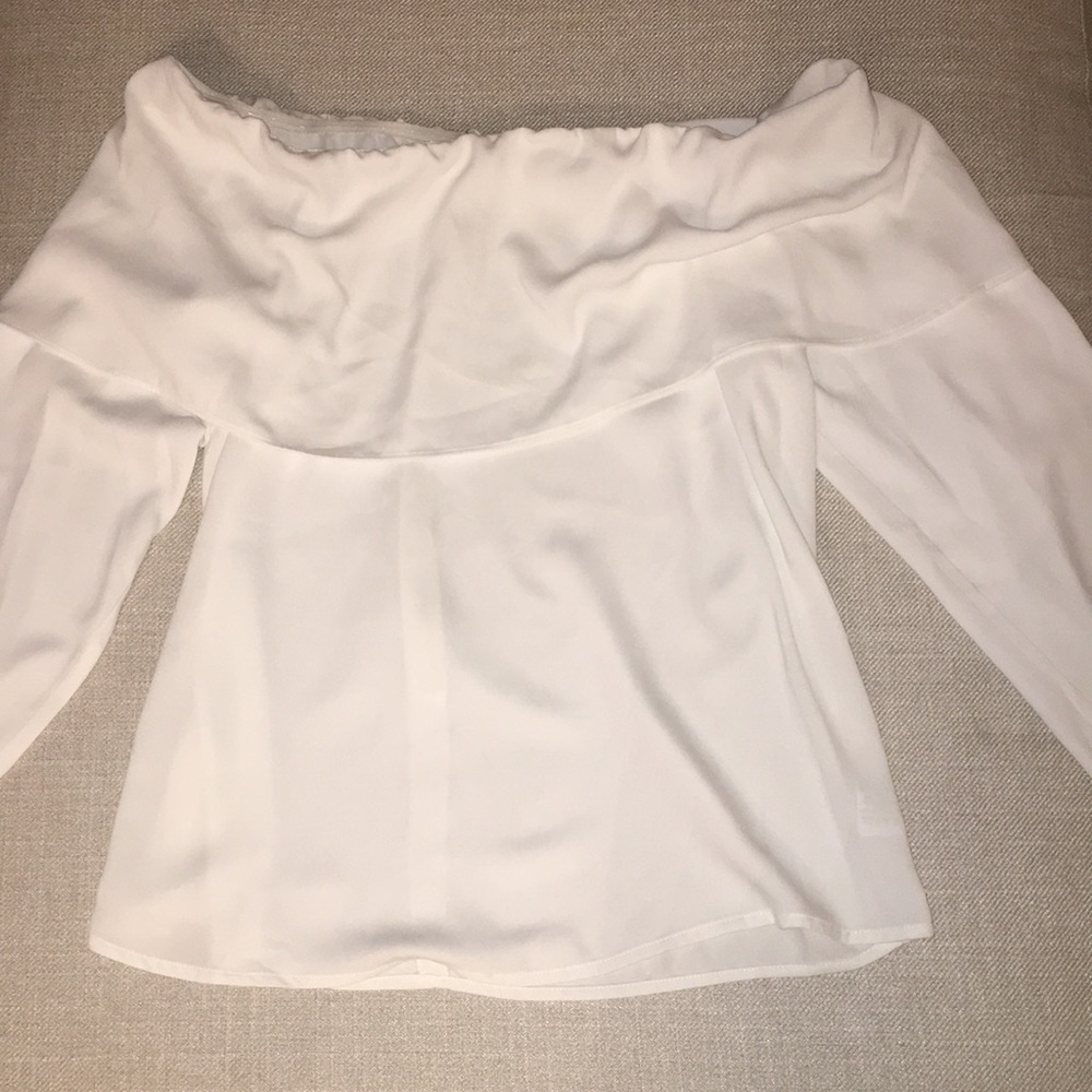 Off the shoulder white long sleeve top.